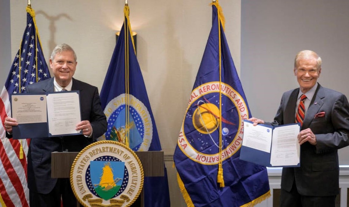 U.S. Secretary of Agriculture Thomas Vilsack (left), and NASA Administrator Bill Nelson, pose for a photograph after having signed MoU, Wednesday, June 21, 2023, at the USDA’s Jamie L. Whitten Building in Washington.